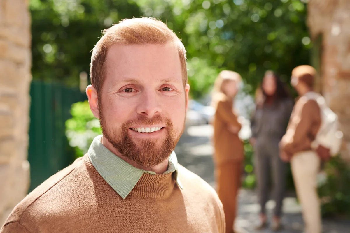 Man outdoors looking at the camera